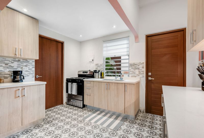Contemporary kitchen with a cozy charm, perfect for preparing and sharing meals.