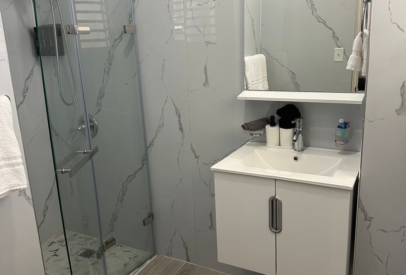 Where elegance meets comfort. Bask in the inviting ambiance of this cozy bathroom.