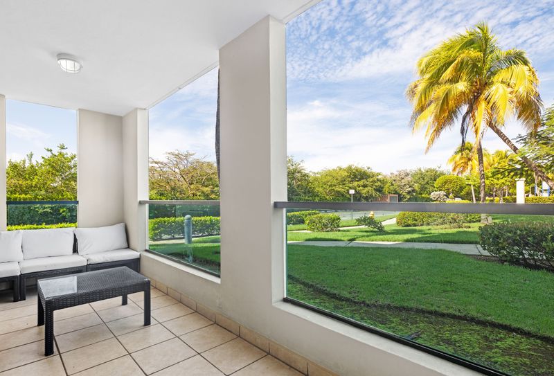 Escape to your own private oasis! This spacious balcony offers breathtaking views of lush greenery and a crystal-clear sky. Relax on the comfortable seating area and enjoy the peace and tranquility of your surroundings. The perfect place to unwind and recharge.