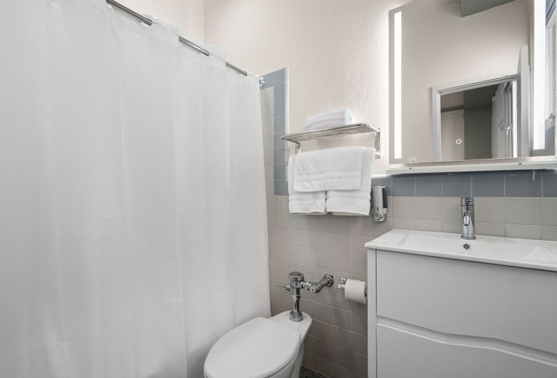 Our spotless bathroom is fully equipped with fresh, fluffy towels and all the essentials, ensuring a clean and comfortable experience for every guest.