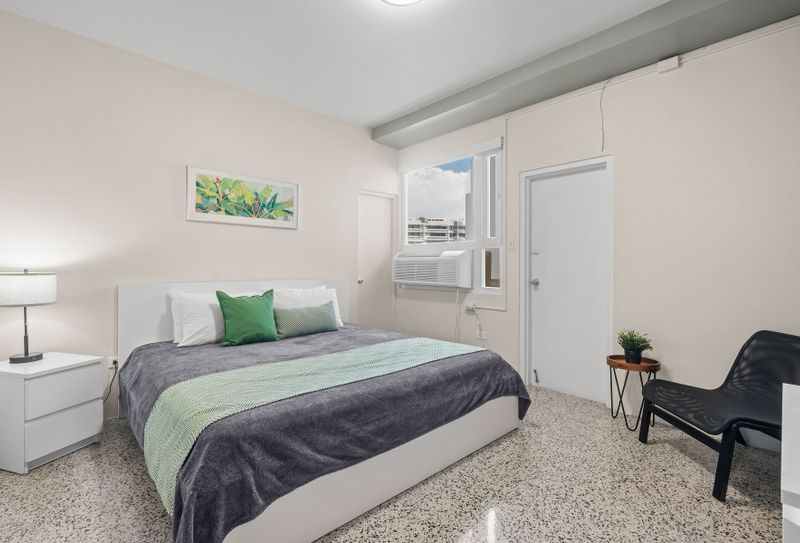 Settle into the pristine comfort of this elegant bedroom. With its fresh linens and thoughtful setup, it's the perfect sanctuary for deep, restorative sleep.