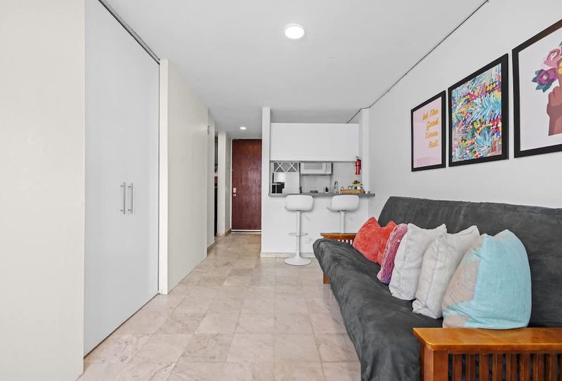 Cozy living area connected to the modern kitchen.
