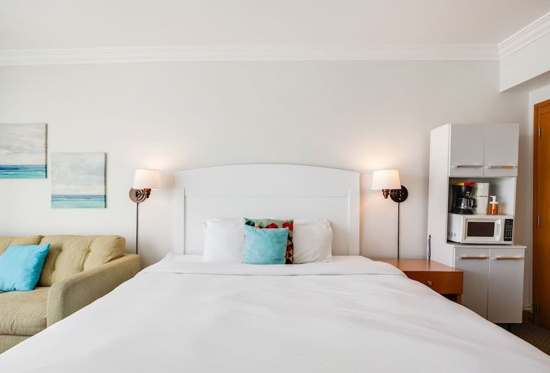 Condado | Beach View Stay 2 Enjoy seamless indoor-outdoor living with private balcony access, providing an exclusive vantage point to the vibrant surroundings.