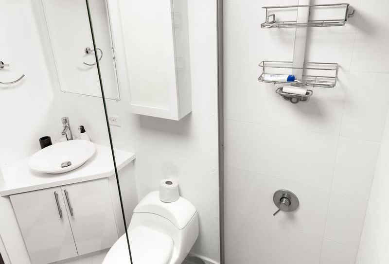 Old San Juan | Vibrant and Modern Stay 4 Refresh and rejuvenate in the sleek and modern bathroom. Enjoy a luxurious rain shower, convenient organizers for your toiletries, and a stylish stainless steel faucet, all designed for your comfort and convenience
