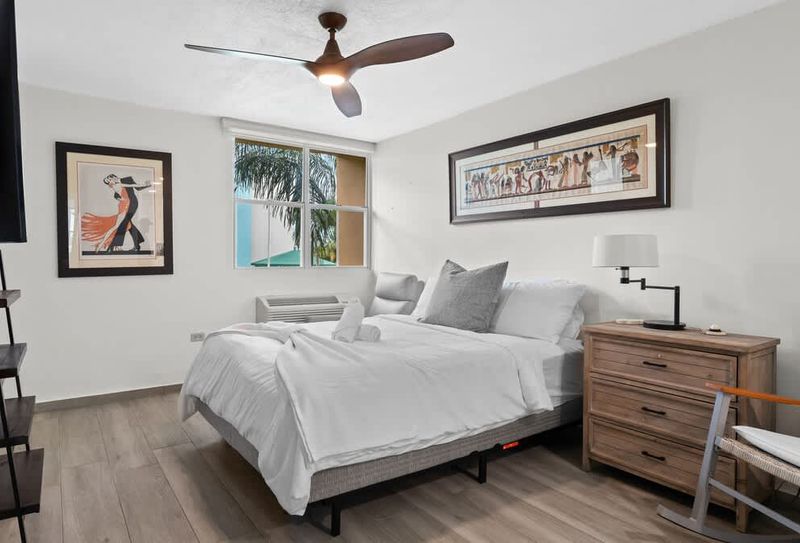 Bright and spacious bedroom with comfortable bed and natural light. A peaceful and inviting atmosphere awaits.