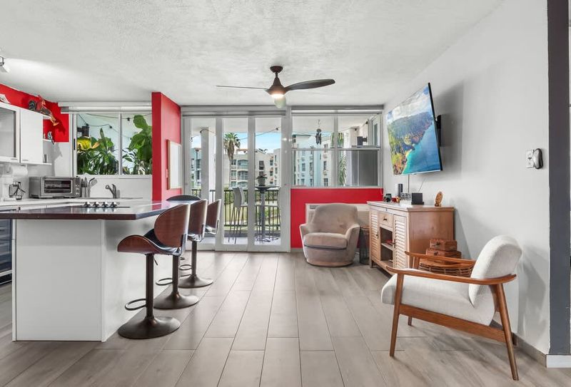 Chic open-concept living and dining area for comfort and entertaining. Enjoy stylish relaxation and meals.