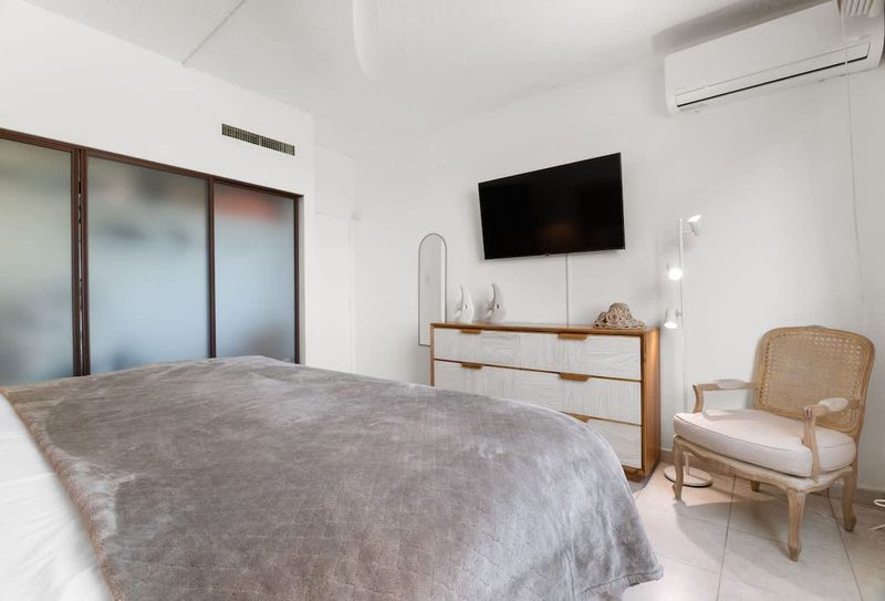A serene bedroom with a minimalist design, ensuring a tranquil night's sleep.