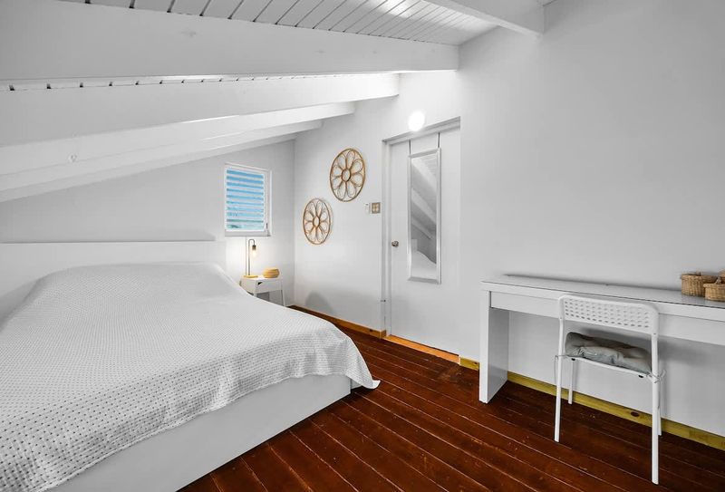 A quiet, cozy bedroom with soft linens.