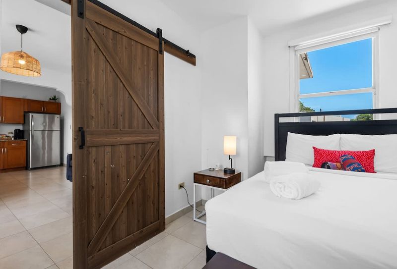 Spacious Master Bedroom with Tropical Decor.