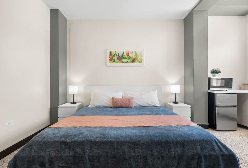 Step into comfort and relaxation! This bright and inviting bedroom offers a plush bed and ample space to unwind after a day of exploring.