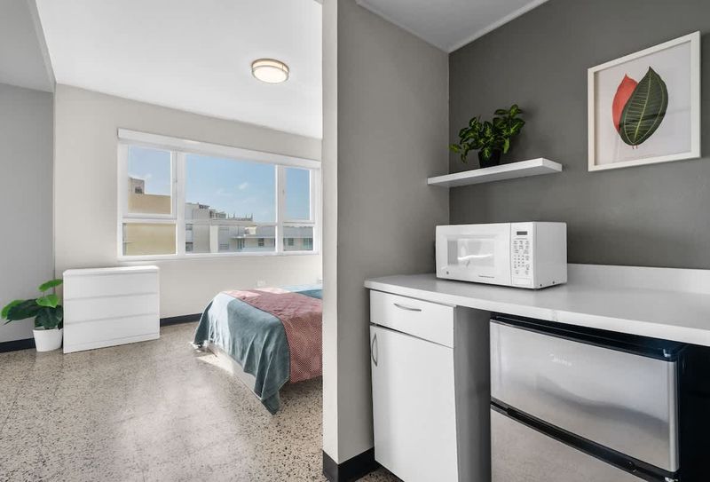 Olimpo | Double Full Bed Room w/ Balcony 5 Enjoy the ease of having a microwave and mini-fridge right in your room, perfect for keeping snacks and drinks cool or warming up a quick bite.