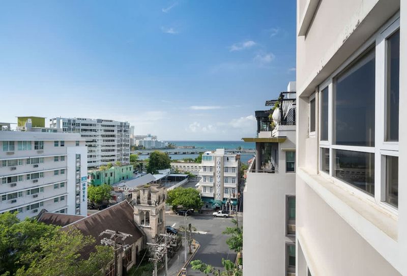 Olimpo | Double Full Bed Room w/ Balcony 3 Enjoy the vibrant city life from your private balcony, offering a refreshing view of the surrounding architecture and a glimpse into the local ambiance.