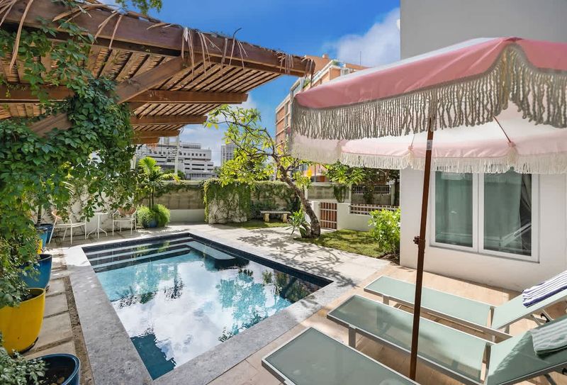 Relax under the parasol with a drink, and enjoy the sun.