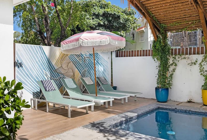 Your own outdoor space with a pool, hammock, and sunbeds.