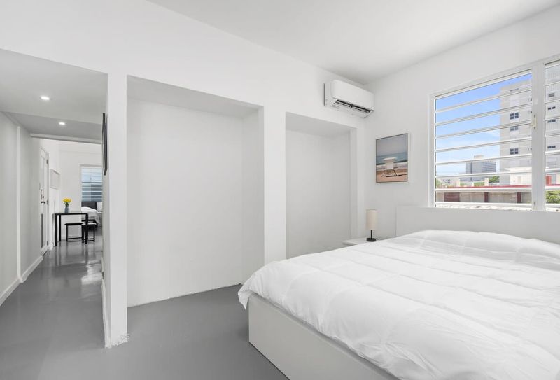 Experience peaceful nights in a generously sized bed, draped in soft, luxurious linens, providing the perfect blend of comfort and sophistication.