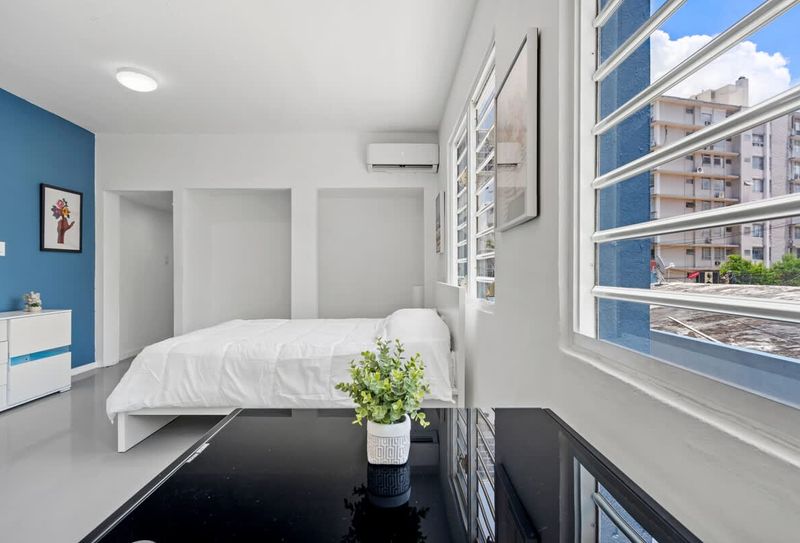 Retreat to a spacious bedroom that seamlessly combines comfort and sophistication.