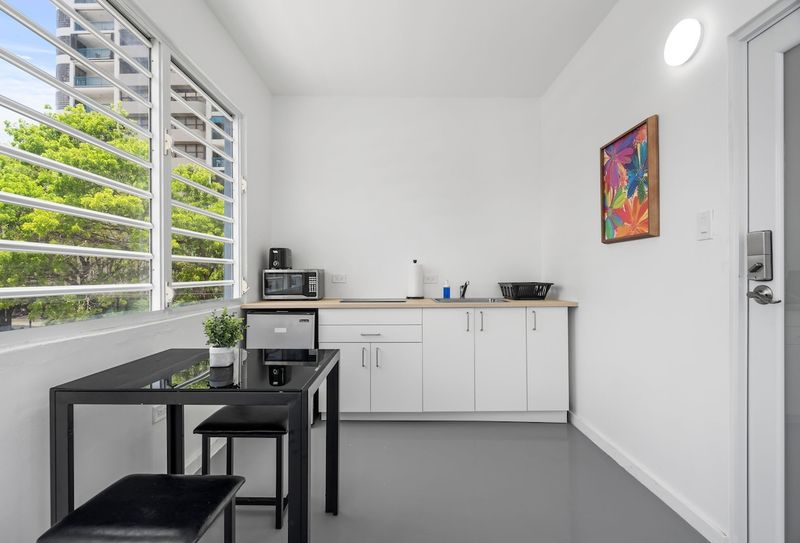 Condado Studio for 2 | 6-Min to Beach | Arcade 3 Enter the light-filled kitchenette, fully equipped with modern amenities, creating an ideal space for your stay.