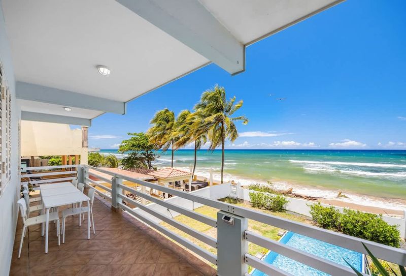 Beachfront House In Puerto Rico 2 Fully equipped kitchen for home-cooked meals. Enjoy breakfast or dinner with natural light and a cozy island feel.