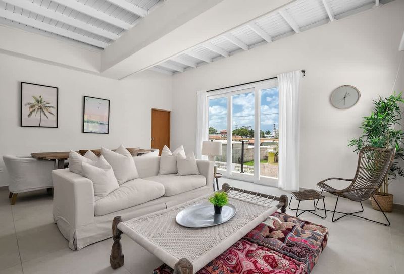 Sunset | Stay in Puerto Rico 5 Seamless indoor-outdoor flow. Bright and inviting living area.