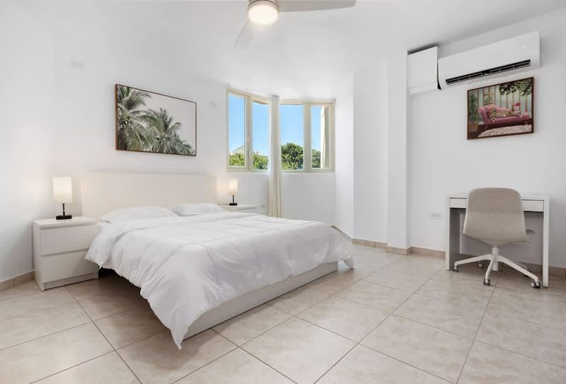 Find your sanctuary in this bright and airy bedroom. Thoughtfully designed with your comfort in mind, it promises restful nights and energizing mornings.