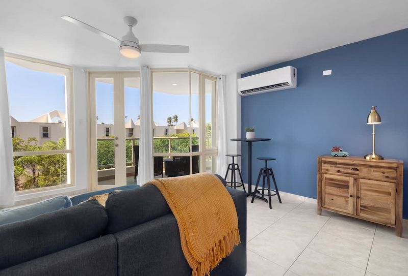 Relax in style! Our comfortable living room seamlessly extends to a private balcony, offering stunning views and a perfect spot to unwind after a day of adventure.