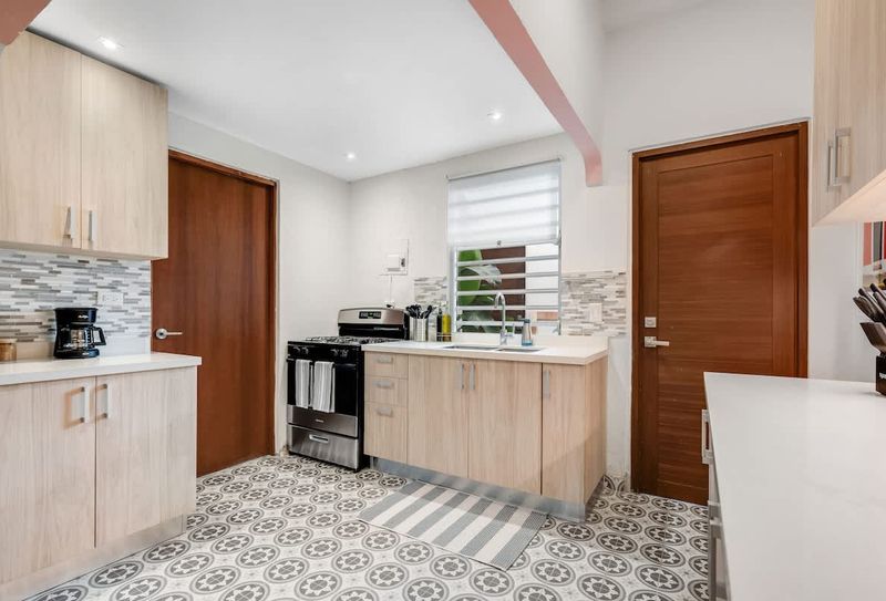 Contemporary kitchen with a cozy charm, perfect for preparing and sharing meals.