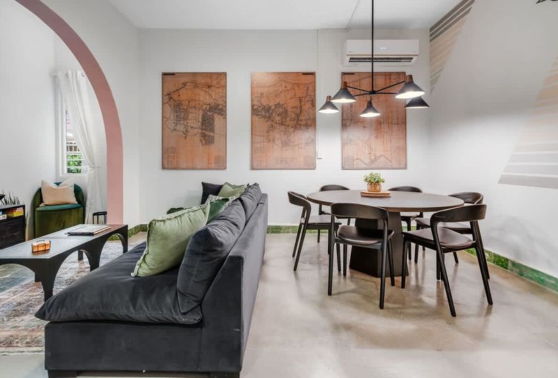 Spacious living area with a stylish dining table, perfect for shared meals and relaxation.