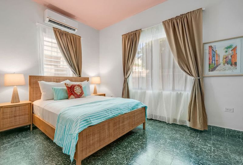 Bright and airy space featuring crisp linens and soft lighting for a restful night.