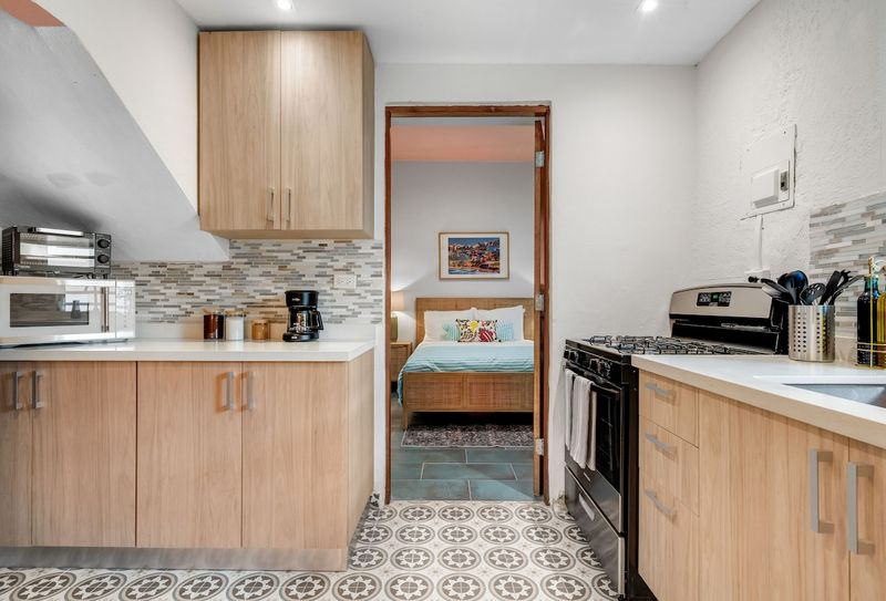 Fully equipped kitchen with modern appliances.