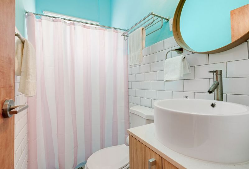 Enjoy a refreshing shower in this minimalist bathroom with clean lines and elegant finishes.