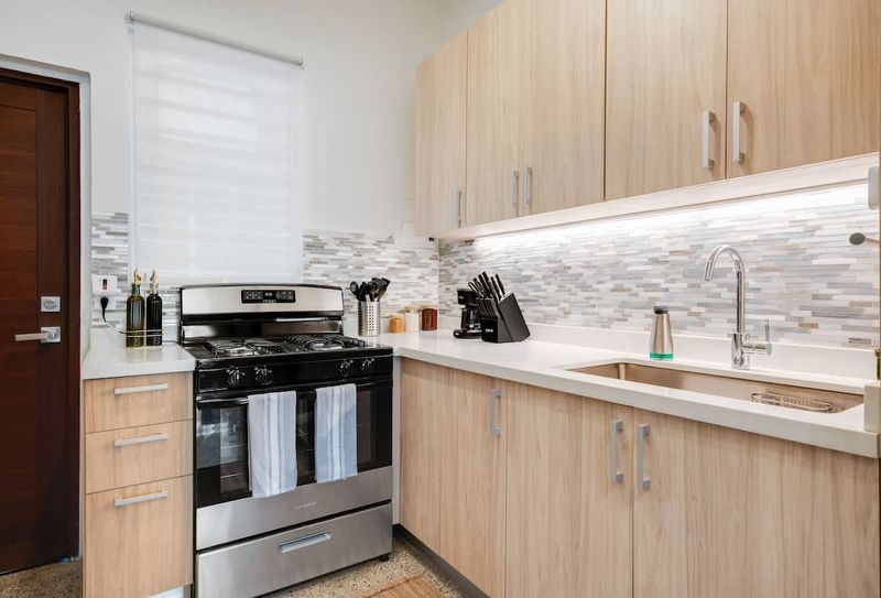 A fully equipped kitchen with sleek, modern design, perfect for preparing your favorite meals.