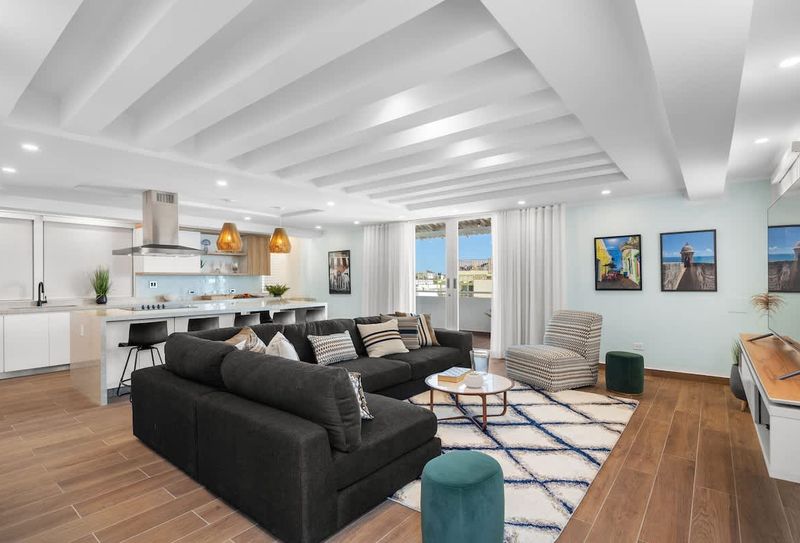 Elena | Condo Rental For Large Groups 5 Step into comfort and style in our spacious living room with modern décor!
