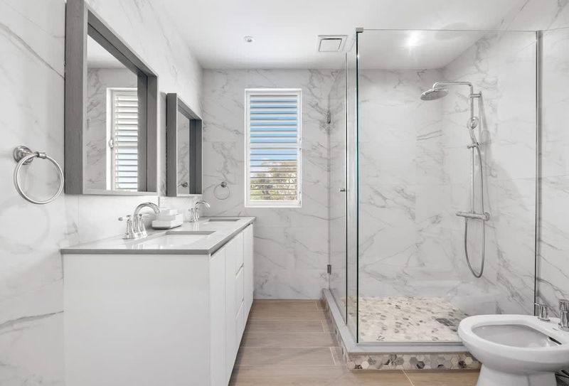 Elena | Condo Rental For Large Groups 4 Indulge yourself in a bathroom designed with contemporary elegance.
