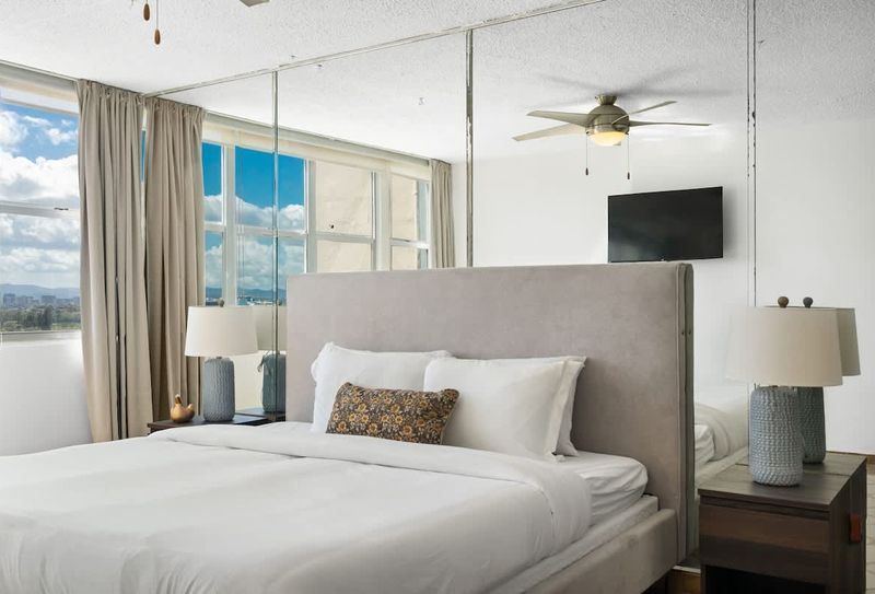 A peaceful retreat awaits. Enjoy ample natural light and refreshing breezes in this thoughtfully designed bedroom, complete with a modern ceiling fan for your comfort.