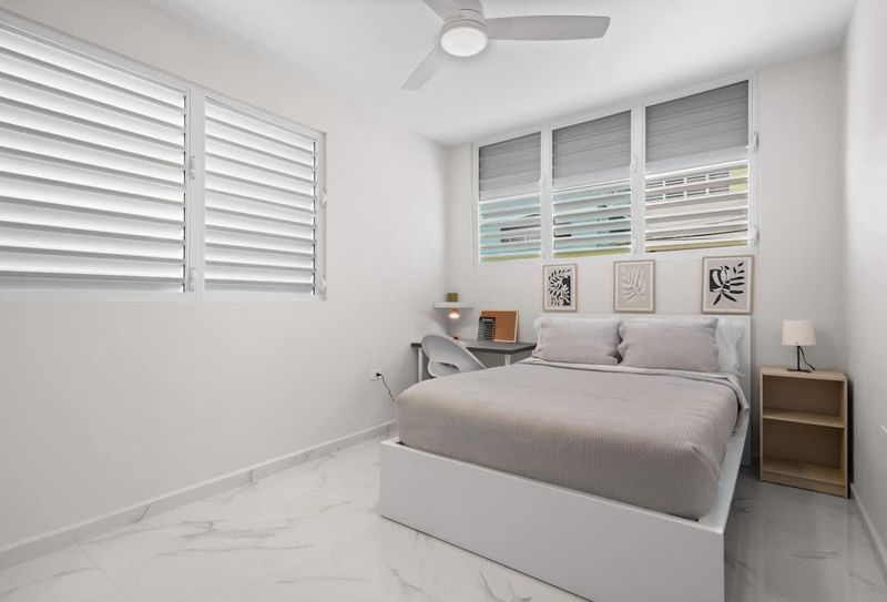 Manati | Vacation Rental 3 Lush, clean queen bed. Minimalist art creates a serene escape.