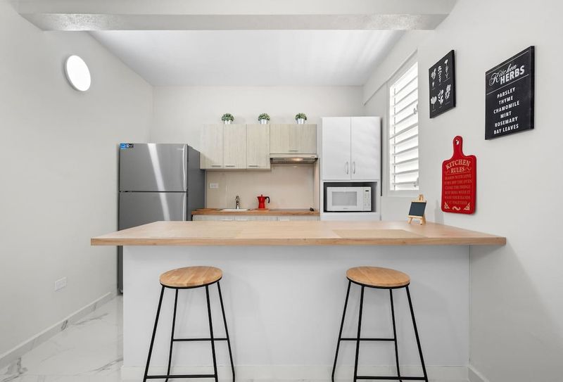 Manati | Vacation Rental 5 Sleek wood counter and modern appliances. Cook like home!