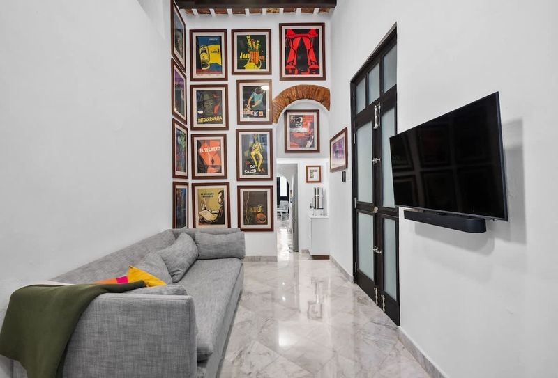 Collector's corner: Eclectic shelving with books, plants, and art.