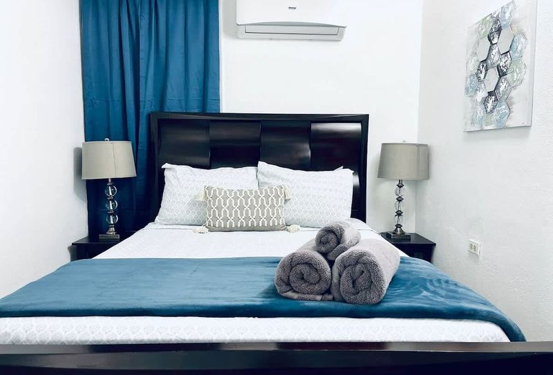 Indulge in ultimate comfort in our serene main bedroom, featuring a luxurious queen-size bed and a Smart TV for your entertainment. Perfect for unwinding after a day of adventures.