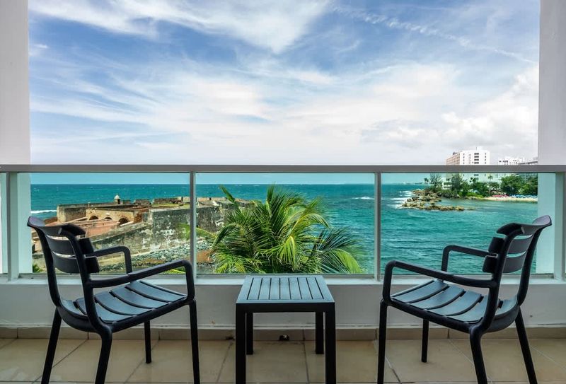Condado | Oceanfront Apartment 3 Your private balcony with stunning views of the historic fort and sparkling ocean. Perfect for morning coffee!