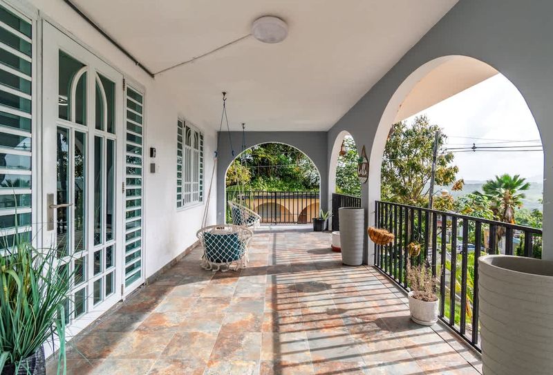 Apartment Near Culebra Ferry 4 Enjoy the fresh air on your spacious patio with a swing chair.