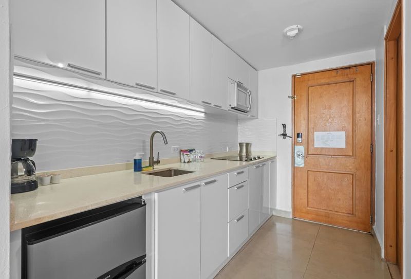 Condado | Beachfront Apartment 3 Whip up delicious meals in your fully equipped modern kitchenette, complete with a microwave, refrigerator, and stovetop