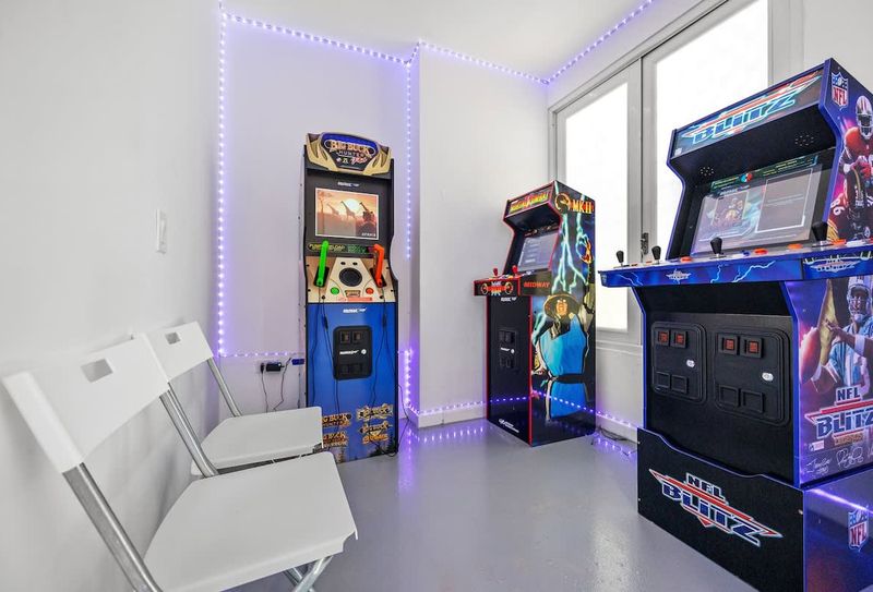 Condado | Near The Beach Condo 4 Enter a sanctuary of fun where each corner is adorned with beloved arcade classics, set against the serene backdrop of modern design.