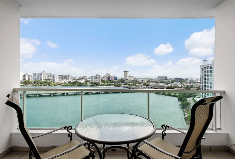 Step out onto your expansive private balcony and be captivated by the sweeping views of the Condado Lagoon and the San Juan skyline. This is your perfect spot for morning coffee or evening cocktails with a view.