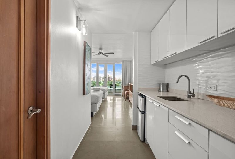 Thoughtfully designed for efficiency and style, our modern kitchenette provides everything you need to enjoy a quick snack or a full breakfast before heading out to explore. The built-in microwave and clean counters make meal prep a breeze.