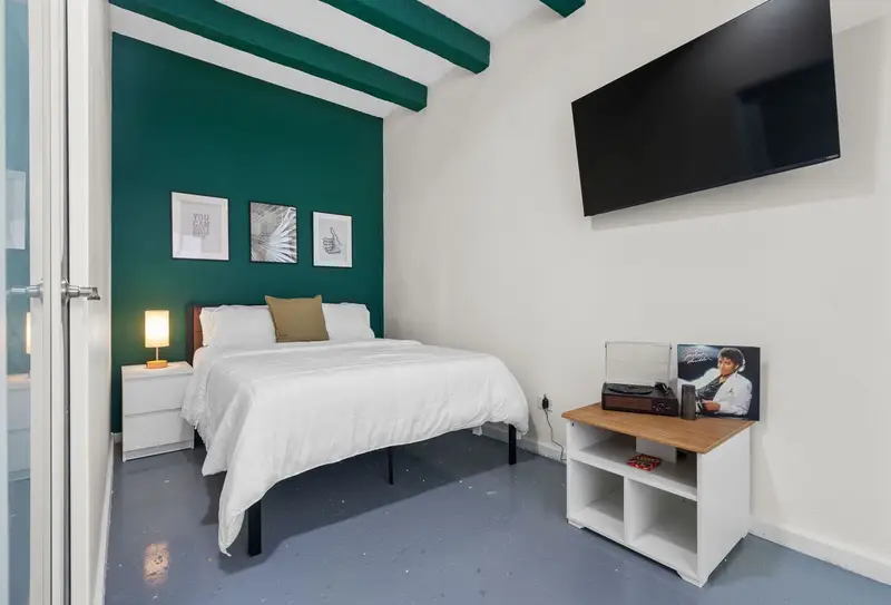 Queen bedroom with A/C, smart TV & record player