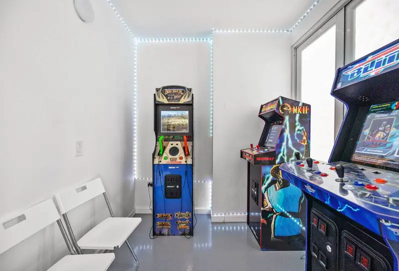 Shared arcade game room in the building – retro cabinets