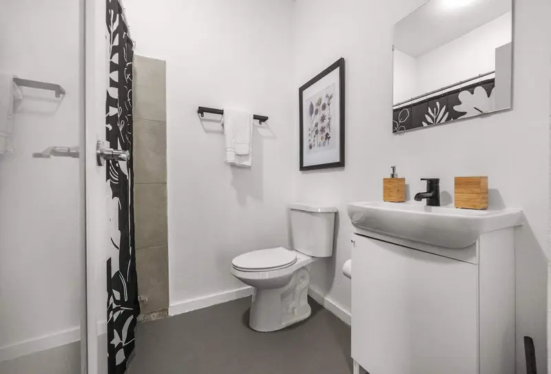 Full bathroom with walk-in shower & toiletries
