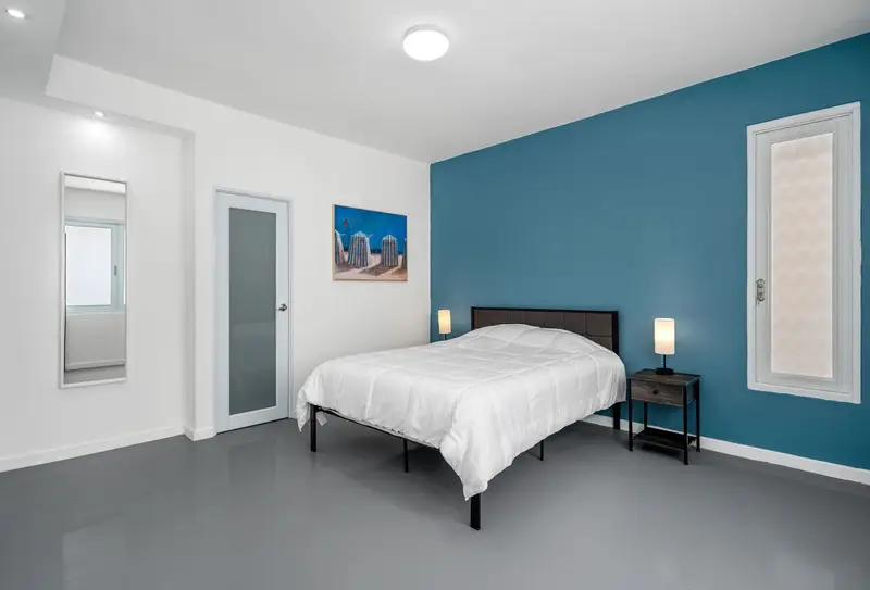 King bedroom with split A/C and beach art