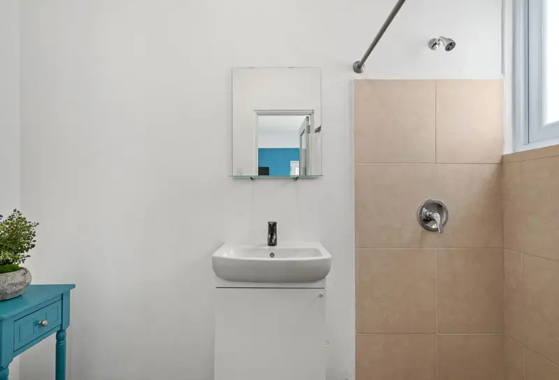 Full bathroom with walk-in tiled shower