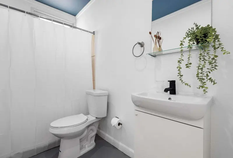 Clean full bathroom with walk-in shower